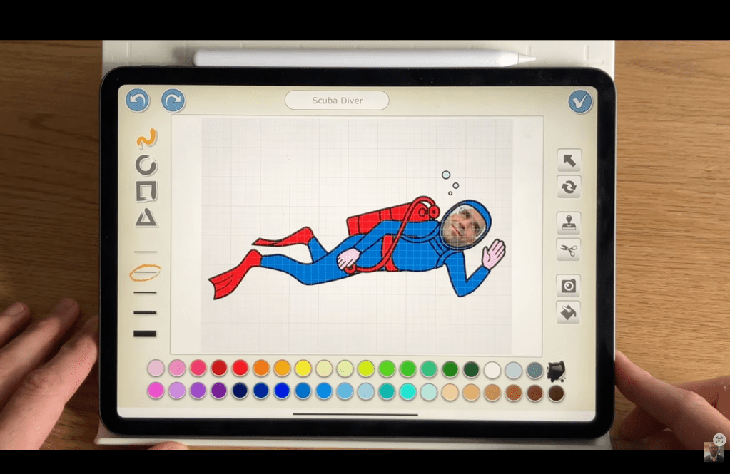 Using the paint option in ScratchJr to create a Superman character.