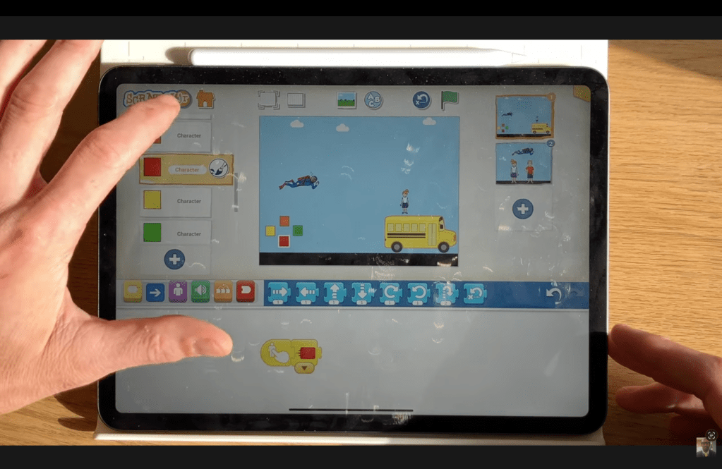The block code for the red joypad button in the ScratchJr Superman Game Project.