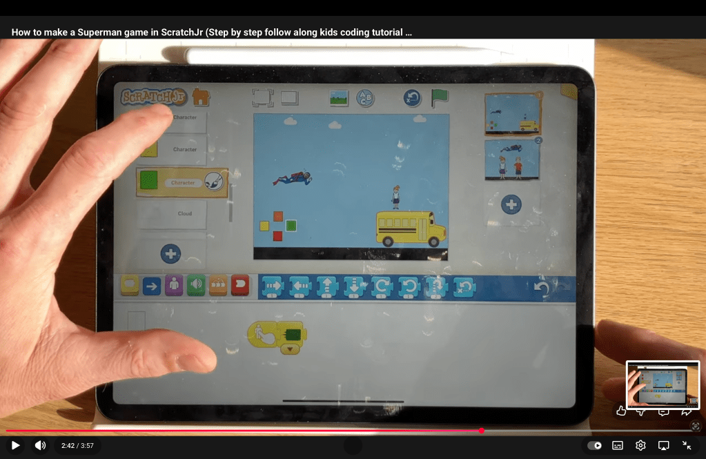The block code for the green joypad button in the ScratchJr Superman Game Project.